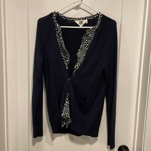 Navy blue cardigan with dot accent and anchor buttons